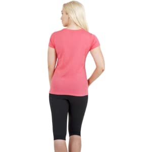 A women's American style T-shirt in vibrant pink, paired with black leggings, featuring a subtle logo.