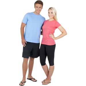 A fitted women's American style T-shirt in coral, paired with black capri leggings. It features a logo on the back.