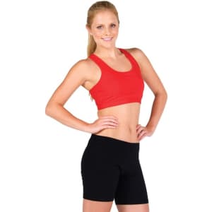 A model wearing a red crop top and black shorts, showcasing a women's self brassiere singlet. The image features a logo.