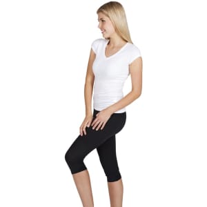 A white women's V-neck T-shirt paired with black leggings. The model is standing sideways, showcasing the shirt.