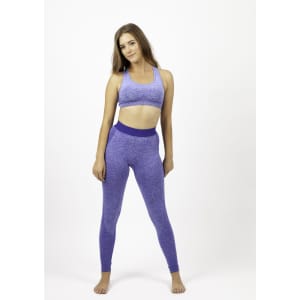A model poses in a light purple seamless crop top and matching leggings, featuring a logo on the crop top.