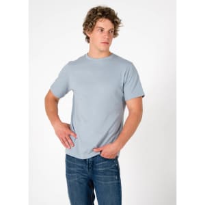 A light blue men's slim fit T-shirt displayed, paired with denim jeans. The shirt has a simple design and a logo.