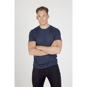 A navy crew neck T-shirt, made from marl fabric, displayed on a male model with casual black pants.
