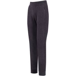 Brushed fleece track pants in black, featuring a waistband and zippered side pockets. Includes a logo on the design.