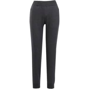 Brushed fleece track pants in dark grey with a fitted silhouette and side pockets. Features a branding logo.