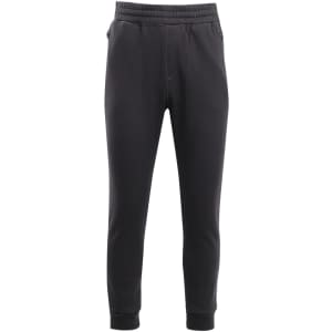 Brushed fleece track pants in black with an elastic waistband and cuffs, featuring pockets and branding.