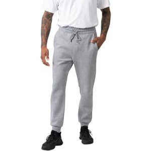 Men's three-layer cotton sandwich track pants in grey, featuring elastic cuffs and a drawstring waistband, with side pockets.
