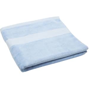 A folded bath towel in light blue with a white striped section and a textured finish.