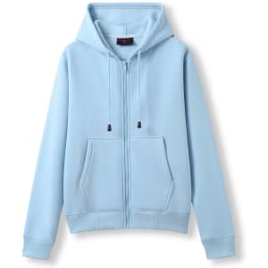Light blue zipper hoodie featuring a pocket and drawstring hood. It has a simple, casual design and fitted cuffs.