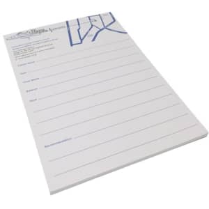 A5 writing pad featuring a white background with blue lines and a header section. It has a logo at the top.