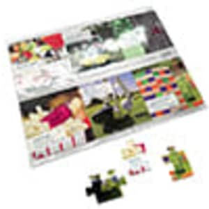 A4 cardboard jigsaw featuring colourful puzzle pieces and an illustrated background. Includes a logo.