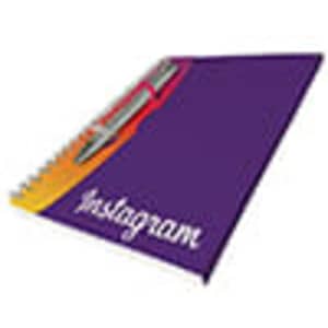 A purple A5 spiral notebook with lined paper and a pen, featuring a logo on the cover.