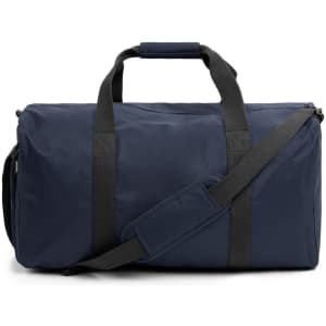 A navy duffle bag with black straps and a shoulder strap, featuring a logo on the side.