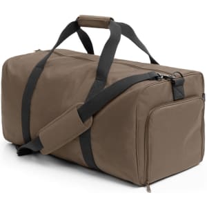 A duffle bag in a muted olive green with black straps and a zippered side pocket, featuring a logo.