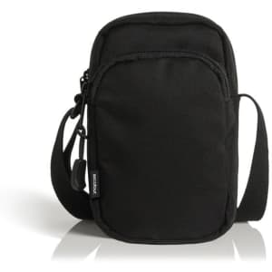 A black recycled camera bag featuring a zippered front pocket and an adjustable strap. It has a brand logo on it.