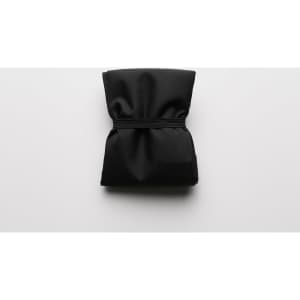 A folded black reusable grocery bag secured with an elastic band, featuring subtle texture and a minimal design.