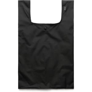 A reusable grocery bag in solid black fabric, featuring a simple design and a logo on the side.