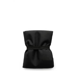 A reusable grocery bag in black, compactly folded with an elastic band securing it.