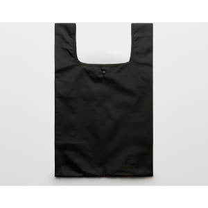 A black reusable grocery bag with a simple design and a button closure at the top.