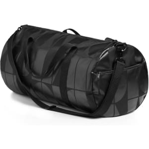 A black duffel bag with a geometric pattern, featuring both handles and a shoulder strap.