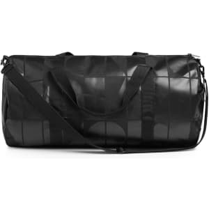 A black duffel bag with a geometric pattern, featuring a shoulder strap and handles, and a logo.