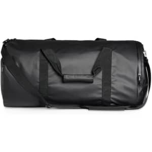 A black duffel bag with sturdy handles and a removable strap, featuring a waterproof material and a logo.