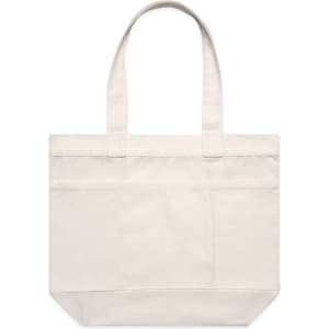 A cream tote bag with two sturdy handles and a front pocket. It features a logo on the surface.