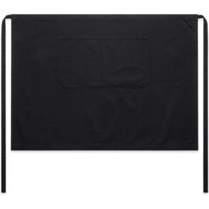 A black canvas half apron featuring a front pocket and ties for securing behind the waist.