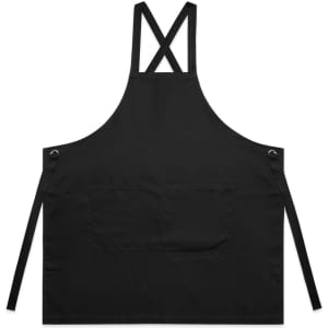 A black apron with crossed straps and a front pocket, featuring metal eyelets and ties on the sides.