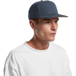 A navy blue cap with a structured front, featuring a logo, worn by a person in a white shirt.