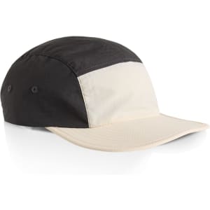 A two-tone nylon cap featuring black and cream panels with a curved brim and side logo.