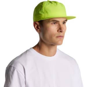 A vibrant yellow cap worn by a model, featuring a flat brim and a logo. The cap is designed for outdoor use.