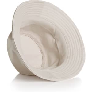 A cream bucket hat with a wide brim, featuring an inner lining and a subtle logo.