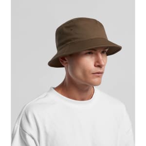 A brown bucket hat displayed worn by a person, featuring a wide brim and a simplistic design.