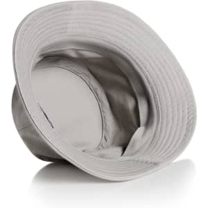 A grey bucket hat with a wide brim and an interior lining, featuring a logo on the inside.