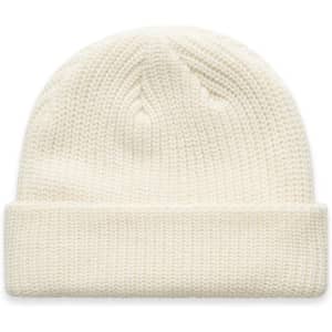 A cream beanie with a ribbed texture and a folded cuff, featuring a logo on the side.