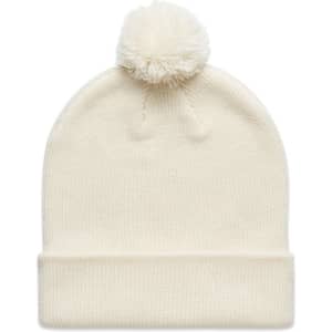 A cream-coloured beanie with a fluffy pom-pom on top, featuring a rolled cuff and a logo.
