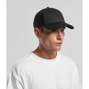 A black trucker cap with a mesh back, featuring a logo on the front, worn by a person in a white t-shirt.