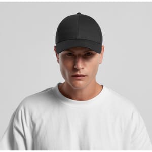 A black trucker cap with a structured front panel and mesh back, worn by a model in a white t-shirt.