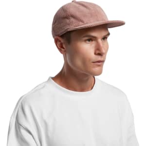 A corduroy cap in a dusty pink hue, featuring a flat brim and a logo on the side.