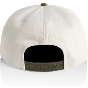 A two-tone cap in cream and olive green, featuring a rear adjustable strap and a logo.