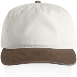 A two-tone cap featuring a cream upper and a brown brim. The cap includes a logo on the front.