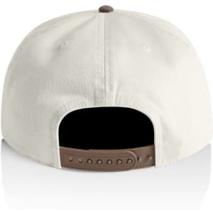 A two-tone cap featuring a cream front and a black back, with an adjustable strap and a logo.