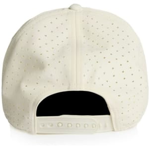 A cream perforated cap with a snapback closure and a logo on the side.
