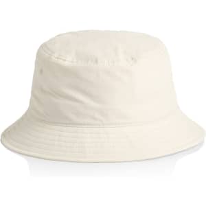 A cream nylon bucket hat with a rounded top and wide brim. It features a logo tag.