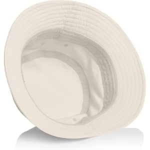 A cream Nylon Bucket Hat featuring a wide brim, with an interior lining and a small logo inside.