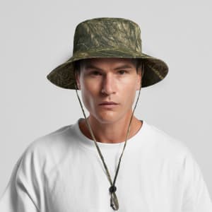 A wide-brimmed camo bucket hat in green tones, featuring a chin strap and a textured pattern.
