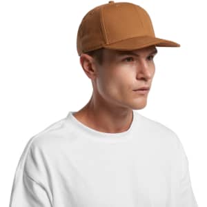 A brown canvas cap featuring a structured design and a logo, paired with a plain white T-shirt.