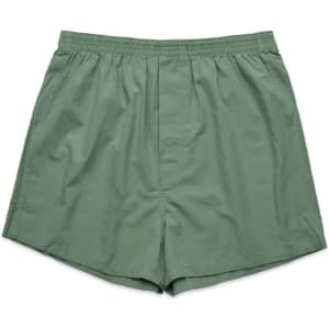 Green boxer shorts with an elastic waistband, featuring a simple design and no visible logos or branding.