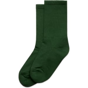 A pair of green socks laid flat, featuring a smooth texture and a simple design. The image includes a logo.